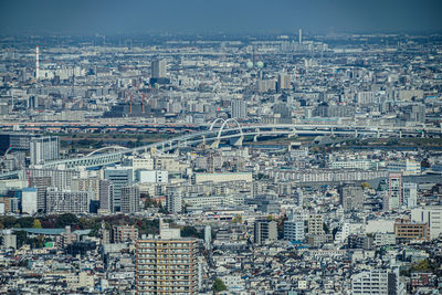 High angle view of city buildings against sky