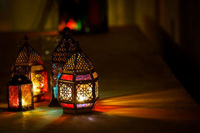 Illuminated lamp in building at night