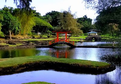 Gazebo by trees against sky