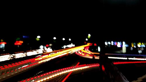 Light trails on road in city at night