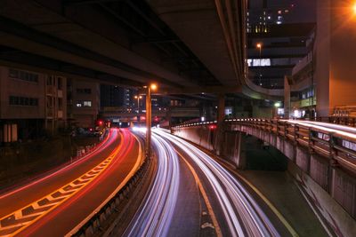 High angle view of light trails on highway at night