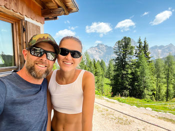 Couple taking a selfie in the refuge in dolomites