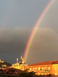 Rainbow over buildings