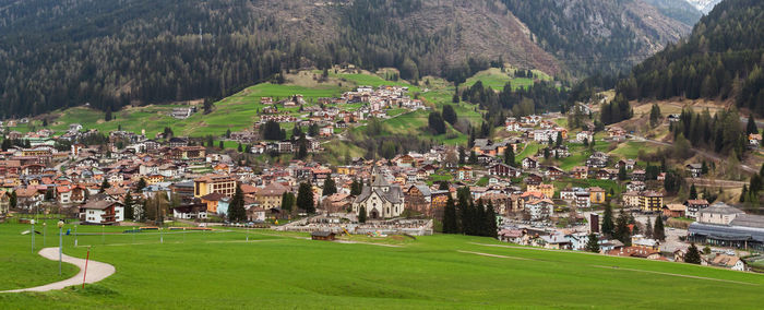 Moena city landscape from surrounding fields, trentino alto adige, italy