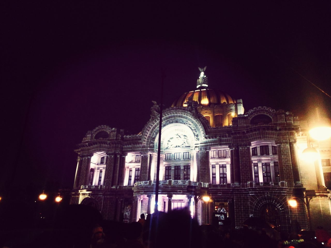 illuminated, architecture, night, built structure, building exterior, religion, place of worship, church, spirituality, cathedral, arch, travel destinations, history, facade, famous place, sky, low angle view, large group of people