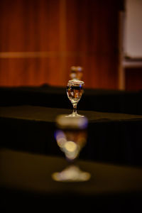 Close-up of wineglass on table