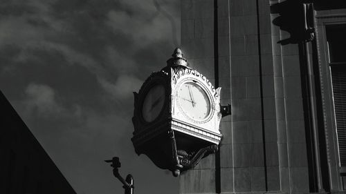 Low angle view of building against cloudy sky