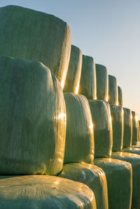 Stack of firewood against clear sky