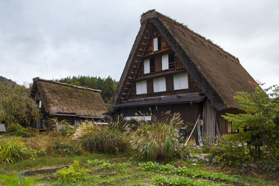 Exterior of house on field against sky