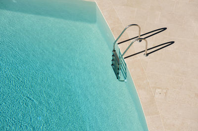 High angle view of ladder on swimming pool