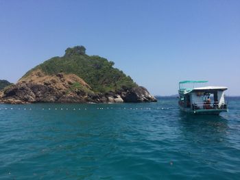 Scenic view of sea against clear blue sky