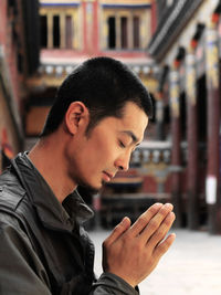 Close-up of man praying