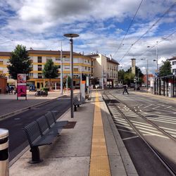 City street against cloudy sky