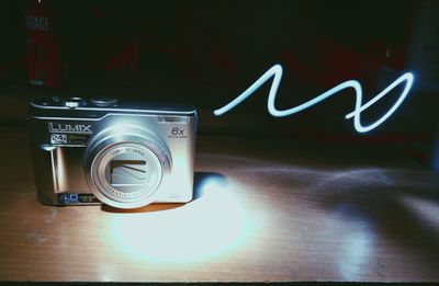 Close-up of camera on table