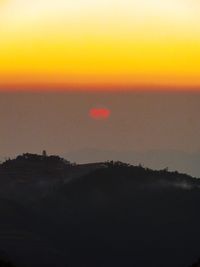 Scenic view of silhouette landscape against sky during sunset