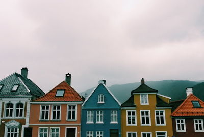 Houses and buildings against sky