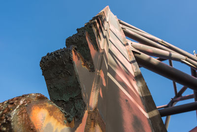 Low angle view of built structure against blue sky