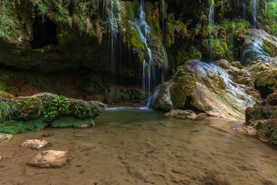 The baume-les-messieurs waterfall is a tourist destination in summer. jura, france.