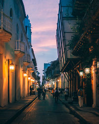 People on street in city at dusk