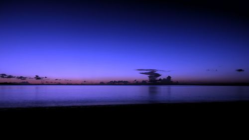 Scenic view of sea against blue sky