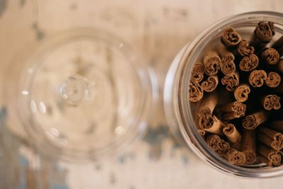 Directly above shot of cinnamons in glass container