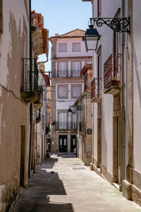 Narrow alley amidst buildings in town