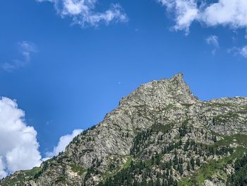 Low angle view of rock formation against sky