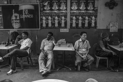 Group of people sitting on table