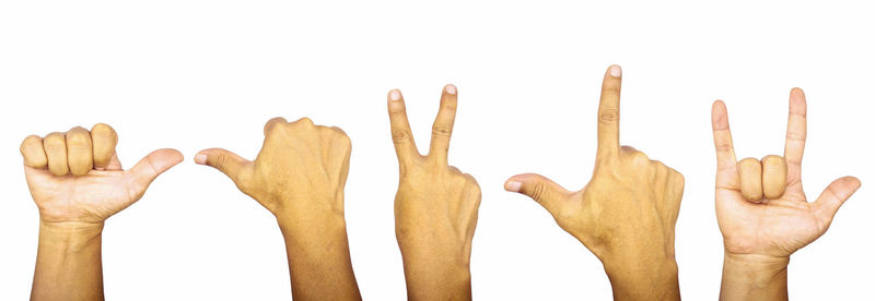 Close-up of hand against white background