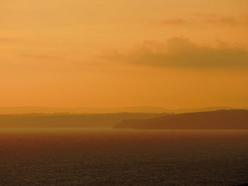 Scenic view of landscape against sky during sunset