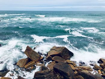 Scenic view of sea shore against sky