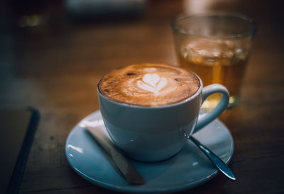 Close-up of cappuccino on table