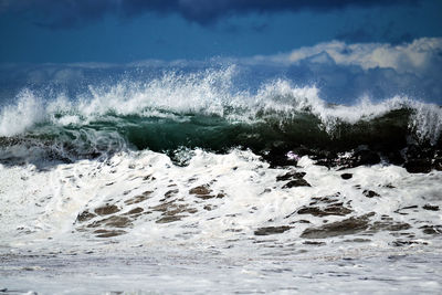 Sea waves splashing on shore