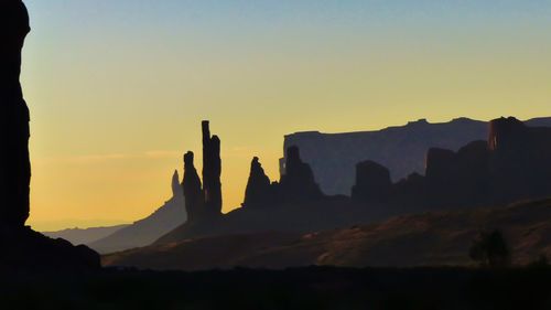 Scenic view of silhouette mountains against sky during sunset