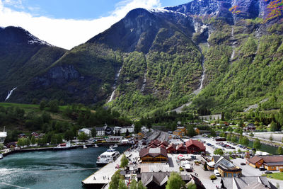 Scenic view of river and mountains against sky