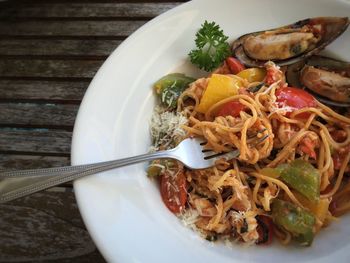High angle view of noodles with mussels served in plate on table