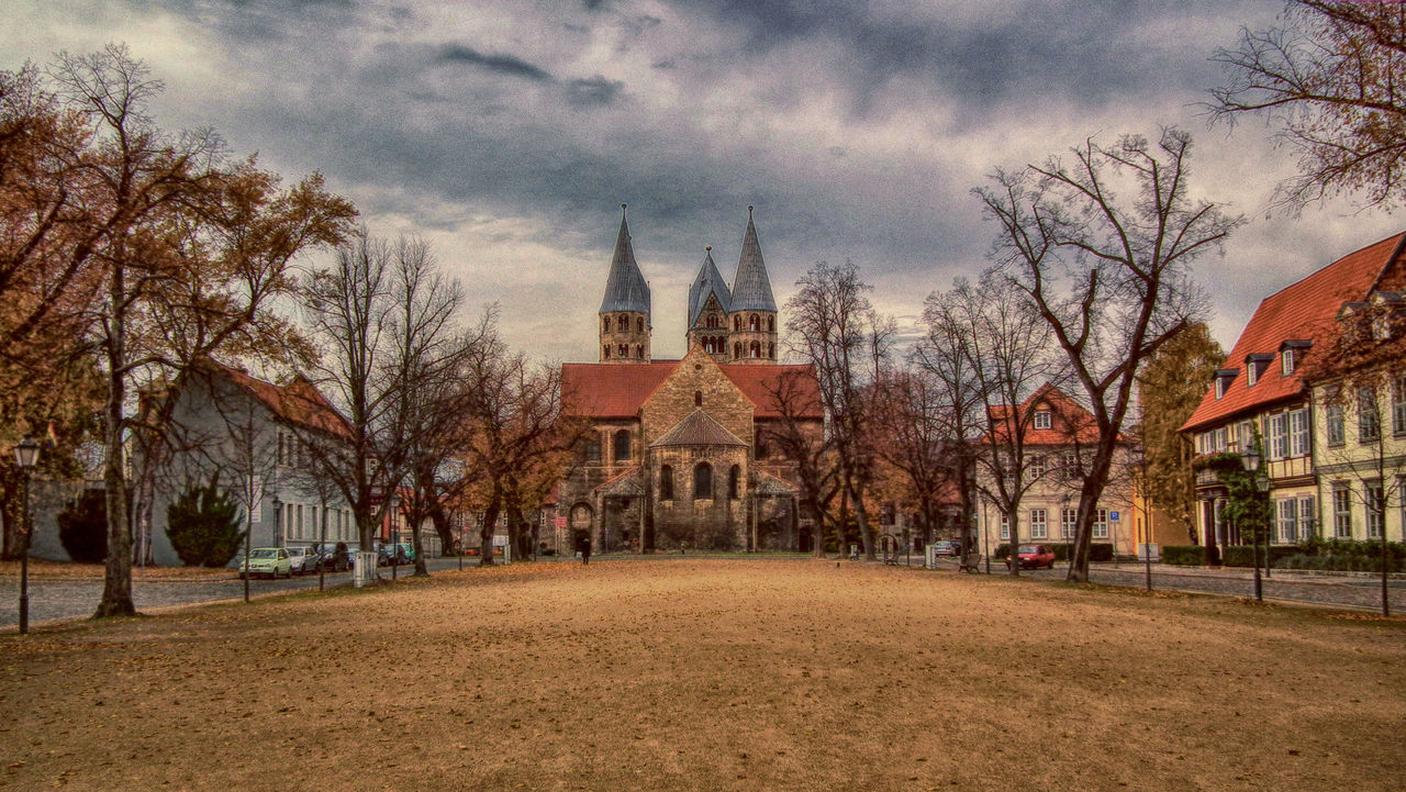 VIEW OF TREES AND BUILDING AGAINST SKY