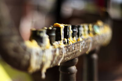 Close-up of melted wax on candlestick holder