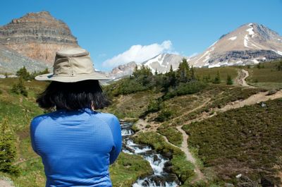 Rear view of man looking at mountains