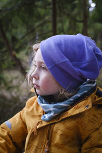 Portrait of girl looking away in winter