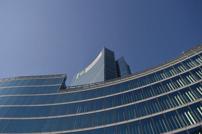 Low angle view of modern skyscraper against clear sky