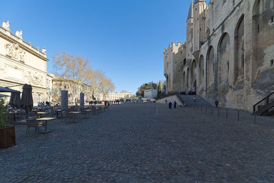 Panoramic view of people on street amidst buildings in city