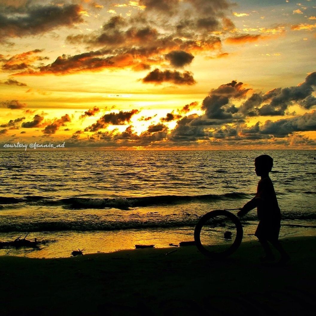 sunset, water, sea, sky, silhouette, leisure activity, lifestyles, bicycle, horizon over water, beach, men, cloud - sky, shore, transportation, mode of transport, scenics, beauty in nature, full length