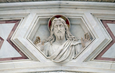 Low angle view of statue against building