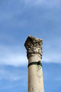 Low angle view of statue against blue sky