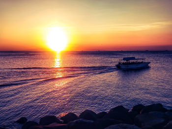 Scenic view of sea at sunset