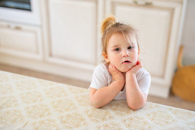 Portrait of cute baby girl at home