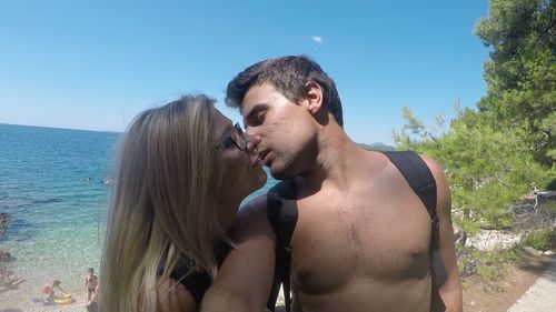 Young couple kissing at beach
