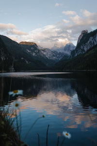 Scenic view of lake and mountains against sky