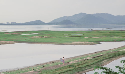 Aerial view of woman standing on field